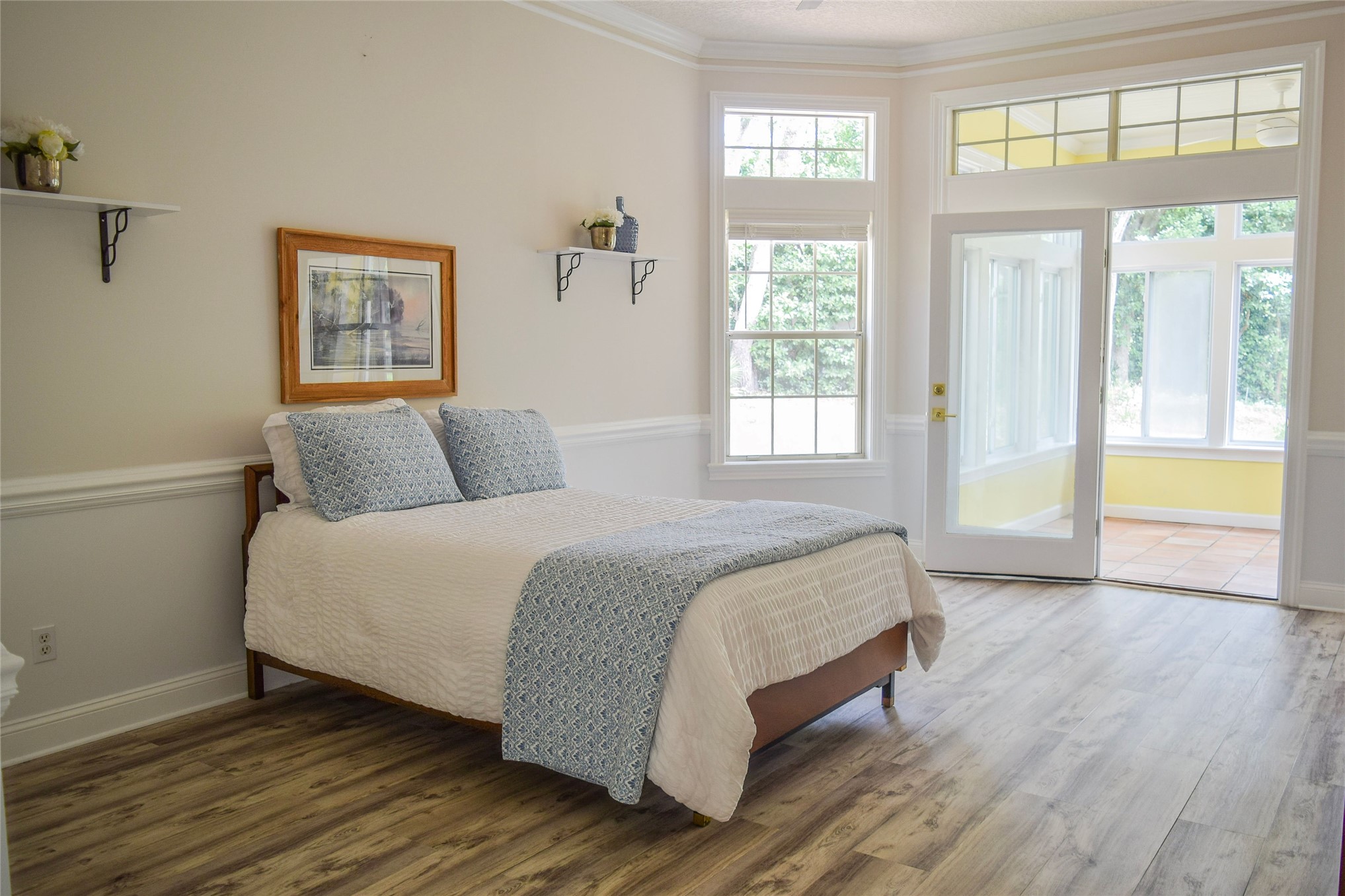 4433 Bean Street Fernandina Beach, FL 32034 - Photo 3 of 79 a bedroom with a bed and wooden floor