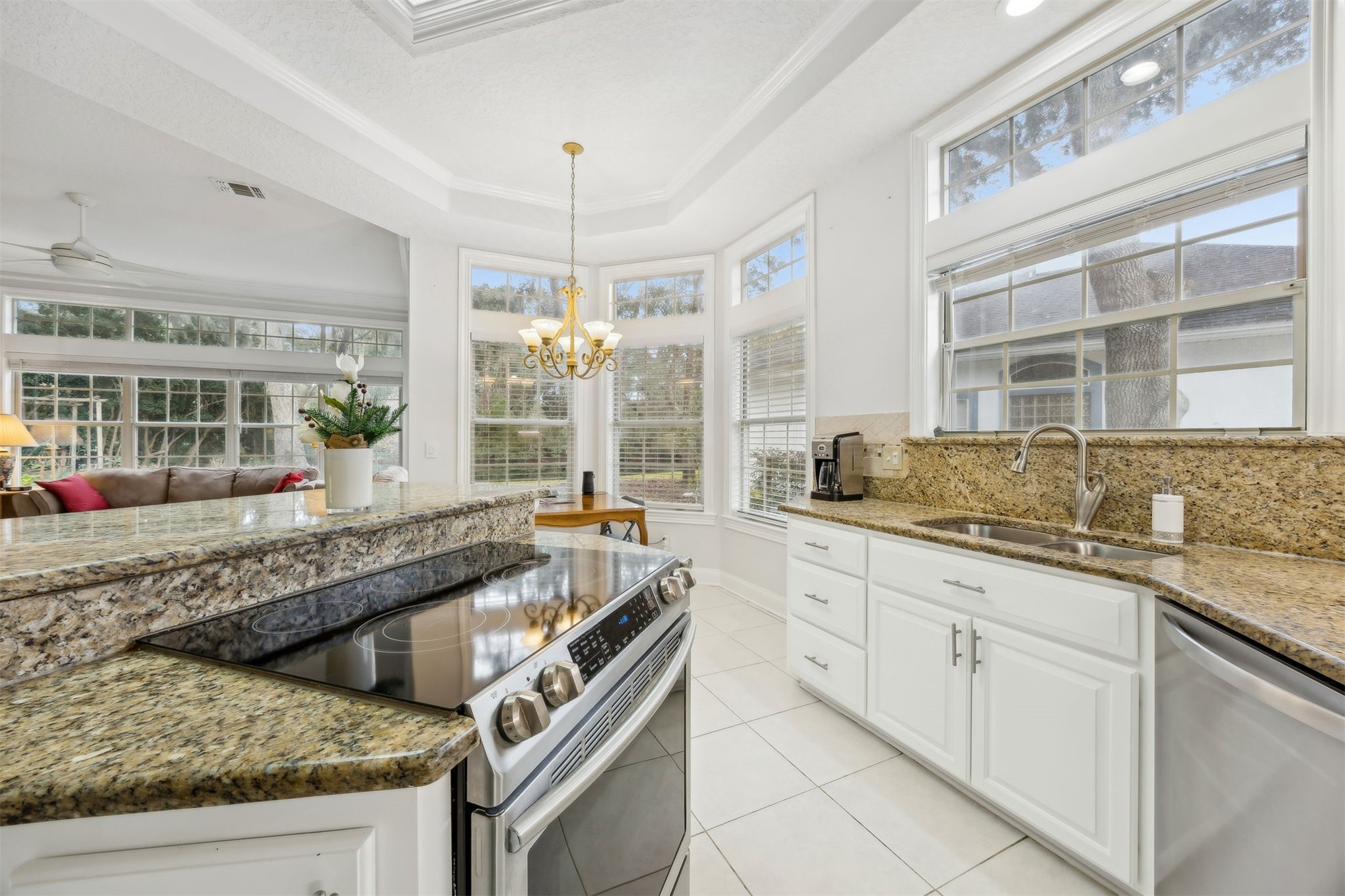 4433 Bean Street Fernandina Beach, FL 32034 - Photo 32 of 79 a kitchen with granite countertop a sink and a counter top space