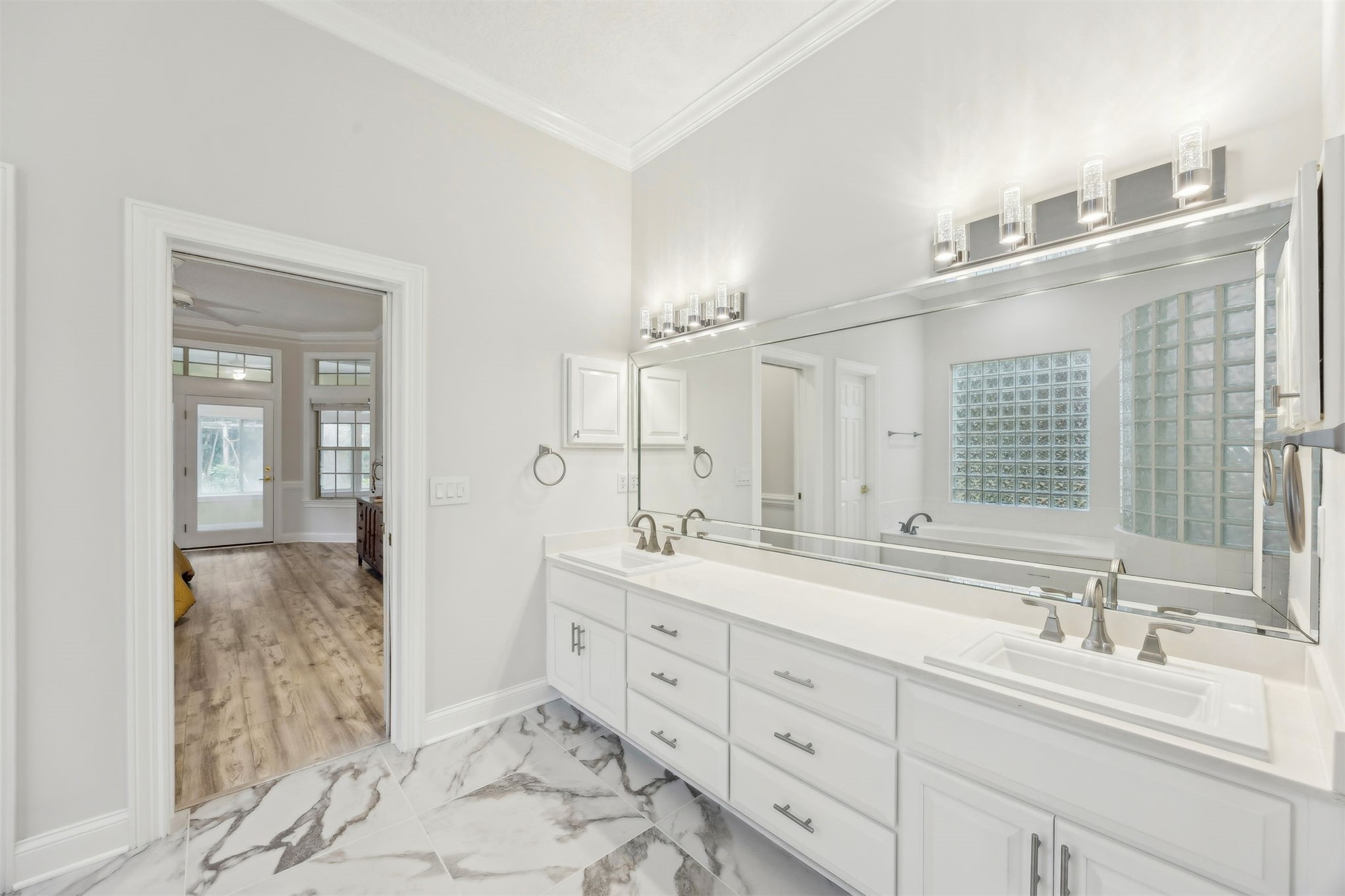4433 Bean Street Fernandina Beach, FL 32034 - Photo 44 of 79 a spacious bathroom with double sink and a mirror