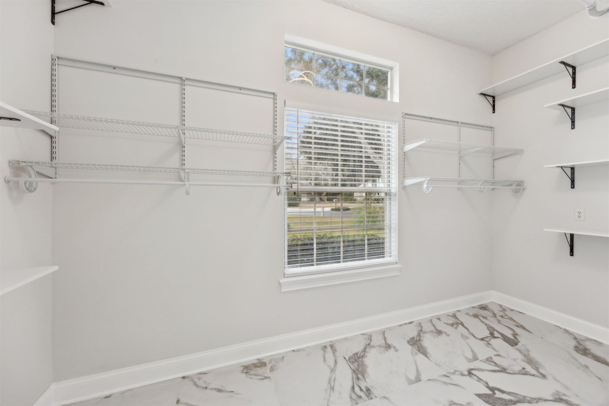 4433 Bean Street Fernandina Beach, FL 32034 - Photo 46 of 79 a view of a bedroom with a bed and a window