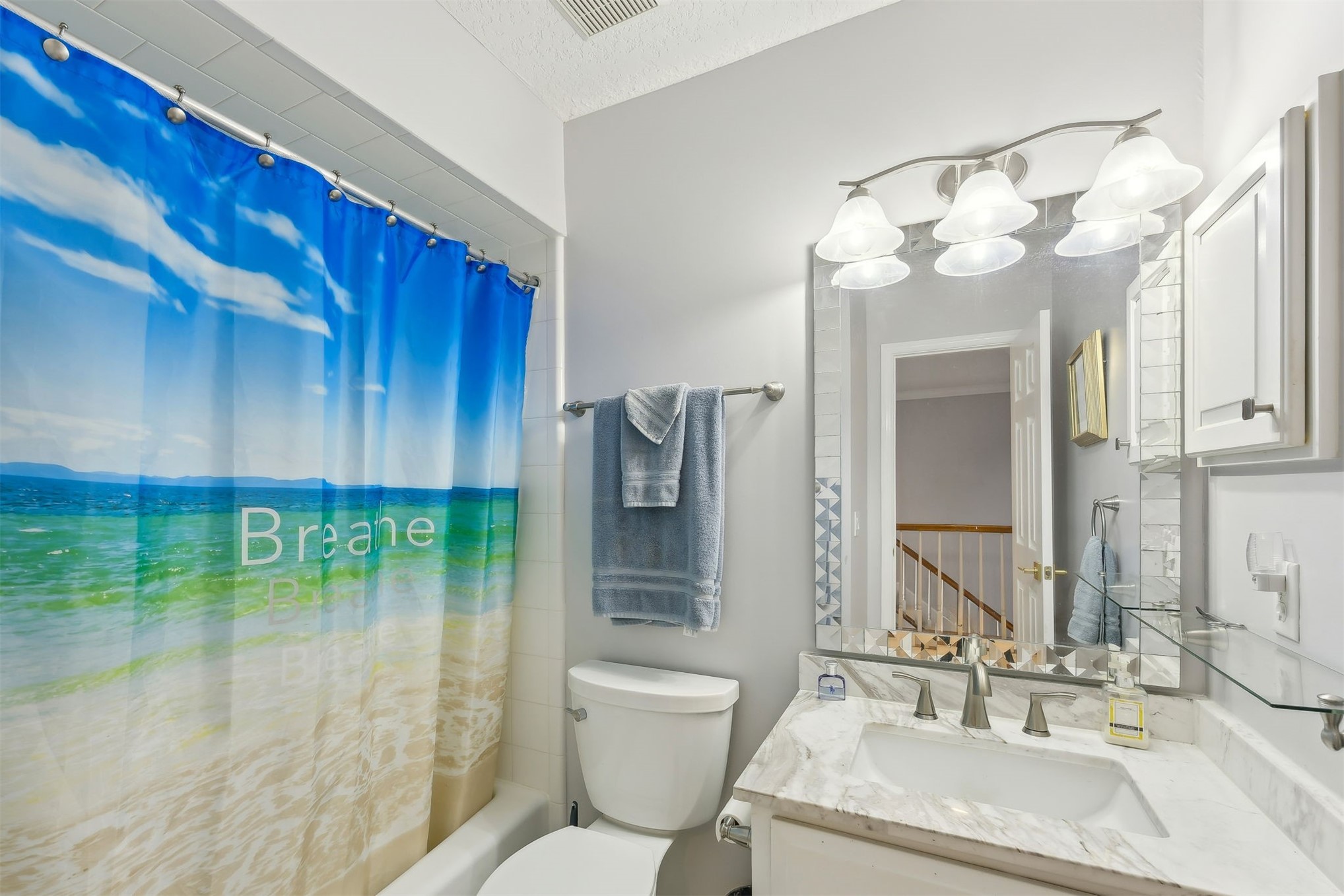 4433 Bean Street Fernandina Beach, FL 32034 - Photo 50 of 79 a bathroom with a sink a toilet and a mirror