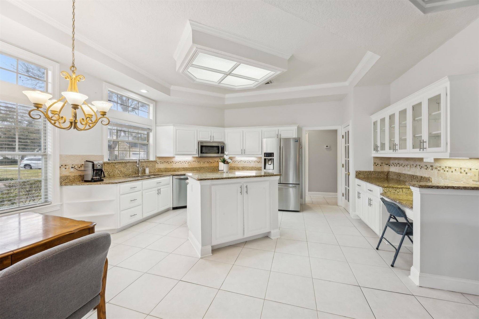 4433 Bean Street Fernandina Beach, FL 32034 - Photo 5 of 79 a large kitchen with cabinets and wooden floor