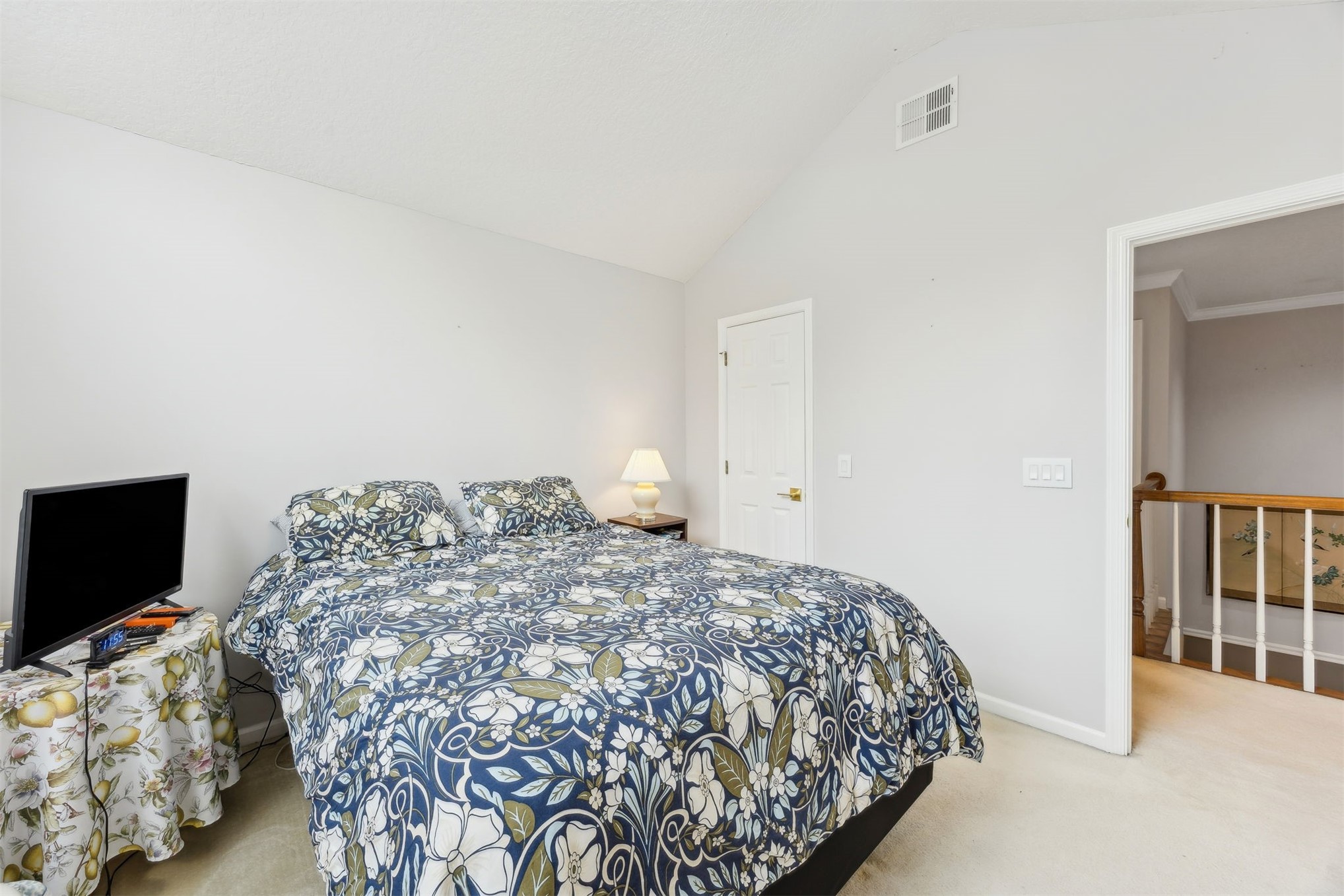 4433 Bean Street Fernandina Beach, FL 32034 - Photo 52 of 79 a bedroom with a bed and a flat screen tv