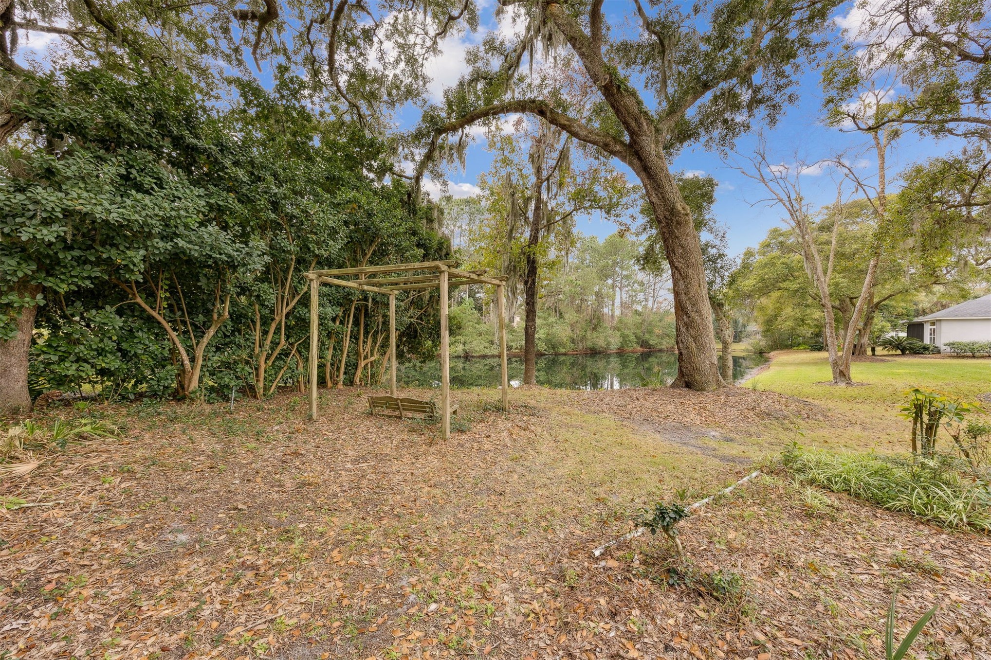 4433 Bean Street Fernandina Beach, FL 32034 - Photo 58 of 79 a backyard of apartments with large trees