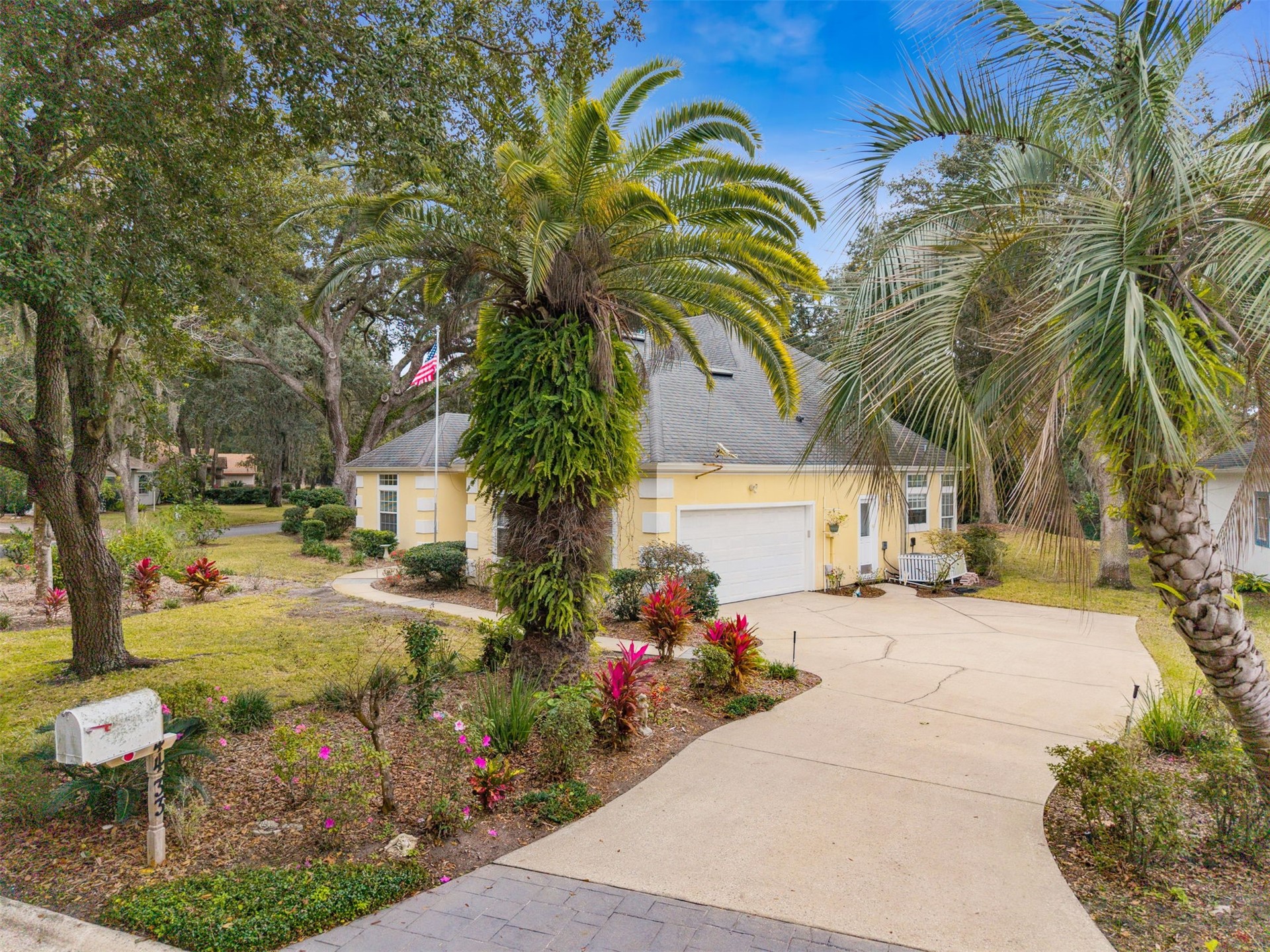 4433 Bean Street Fernandina Beach, FL 32034 - Photo 62 of 79 a view of a backyard with a table and chair under an umbrella