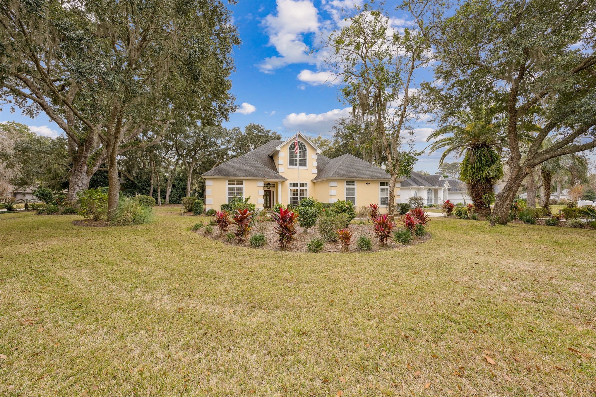 4433 Bean Street Fernandina Beach, FL 32034 - Photo 63 of 79 a front view of a house with a yard and trees