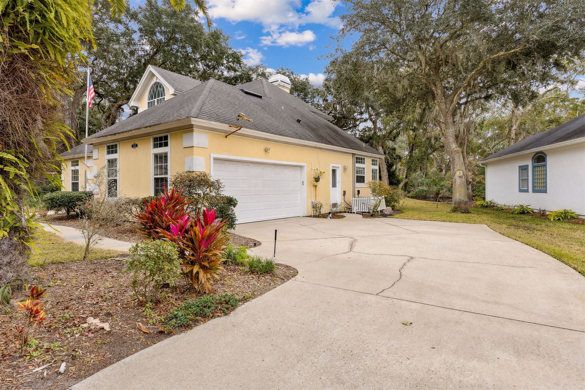 4433 Bean Street Fernandina Beach, FL 32034 - Photo 70 of 79 a front view of a house with a yard and a glass top table