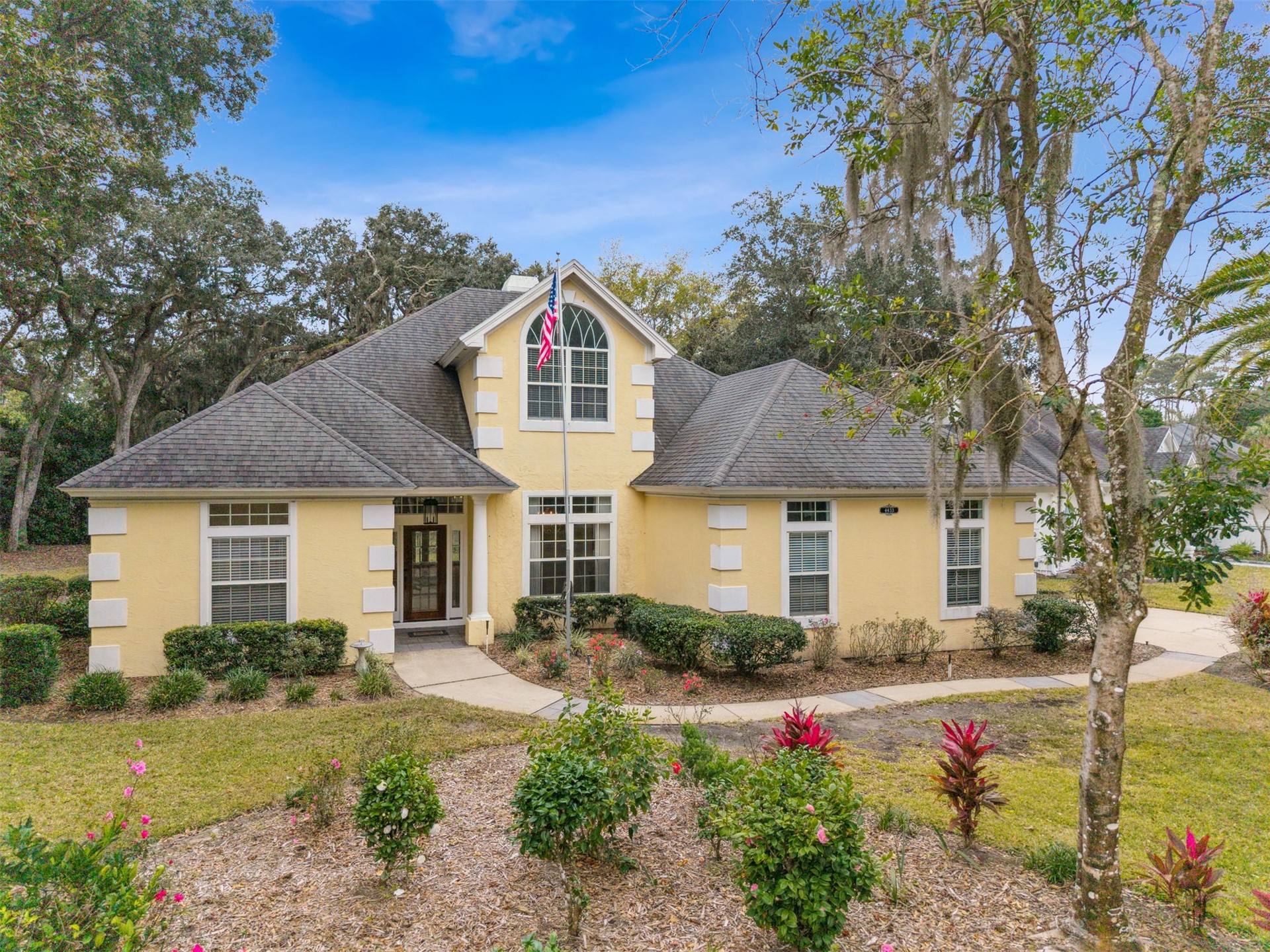 4433 Bean Street Fernandina Beach, FL 32034 - Photo 72 of 79 a front view of a house with garden