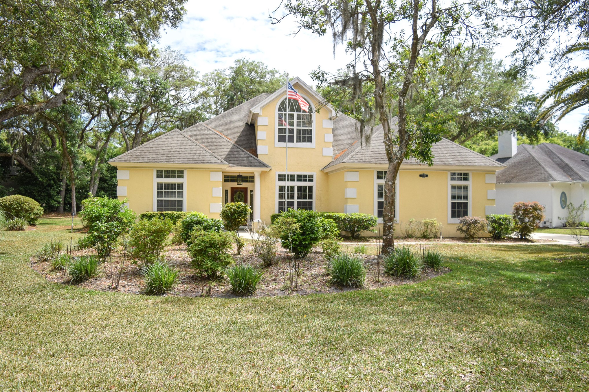 4433 Bean Street Fernandina Beach, FL 32034 - Photo 8 of 79 a front view of a house with a yard and garage