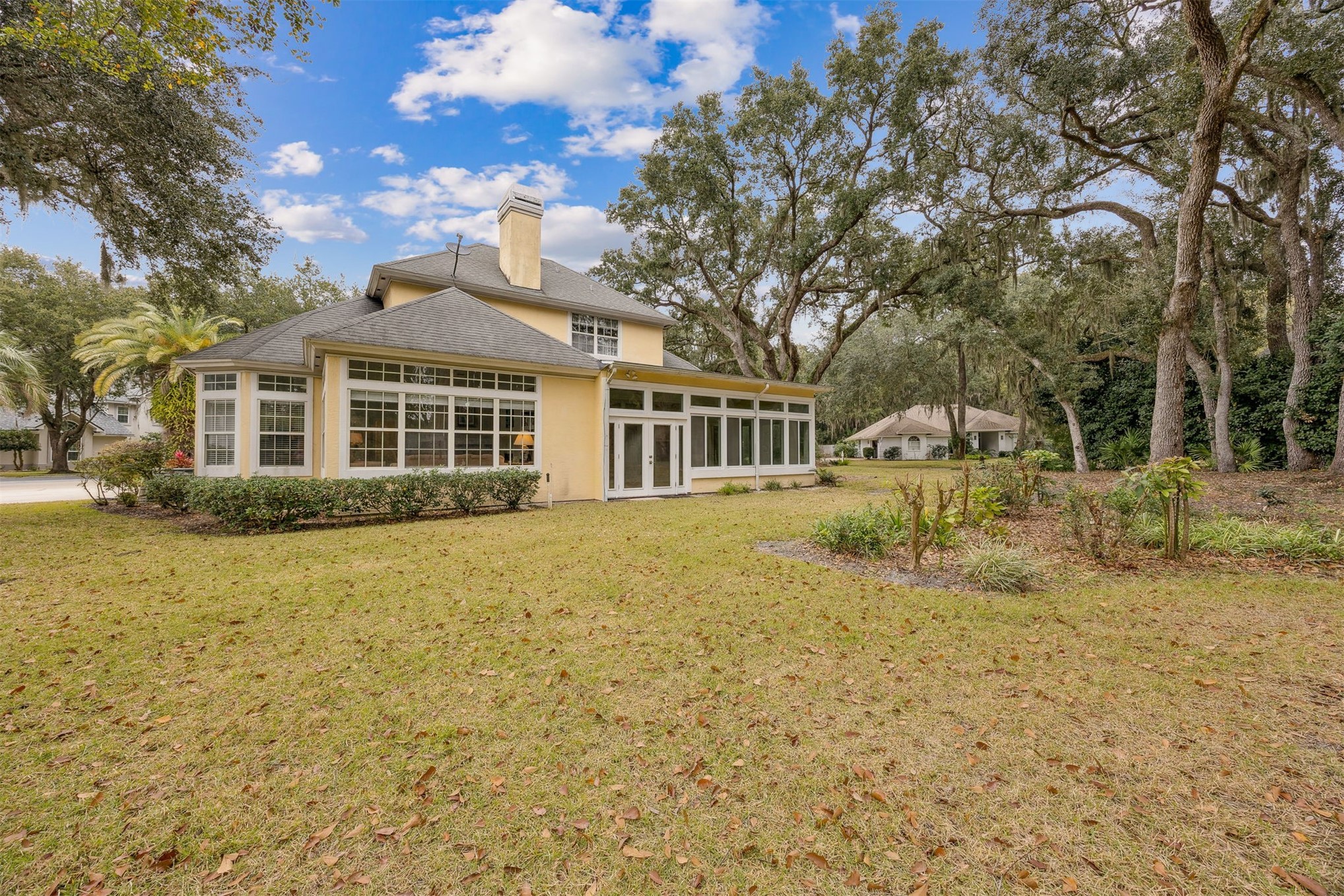 4433 Bean Street Fernandina Beach, FL 32034 - Photo 9 of 79 a front view of a house with a garden