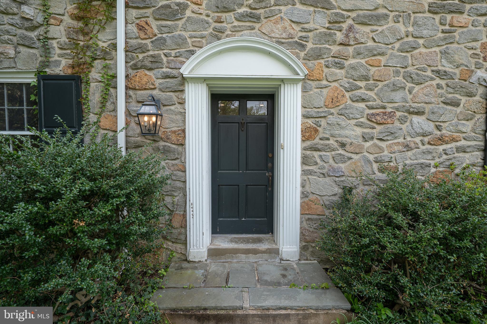 510 Lynmere Road Bryn Mawr, PA 19010 - Photo 2 of 44 front view of a house with a window and potted plants