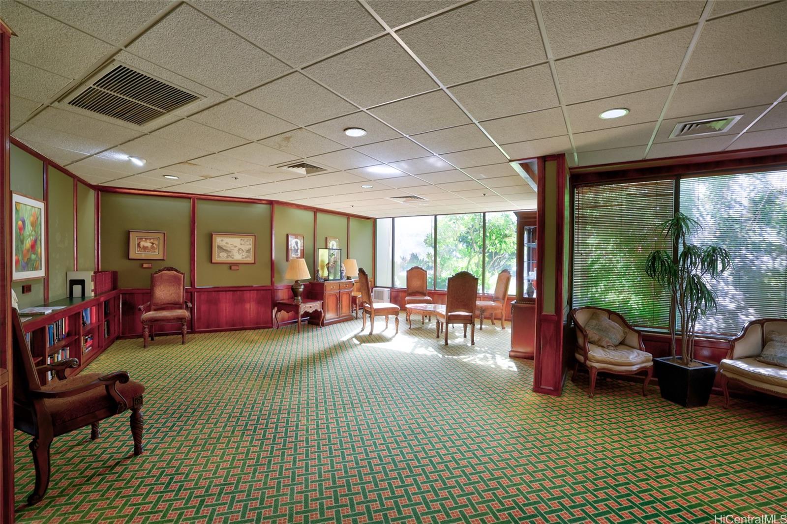 555 Hahaione Street, Unit 3E Honolulu, HI 96825 - Photo 12 of 25 a living room with furniture floor to ceiling window and pool table