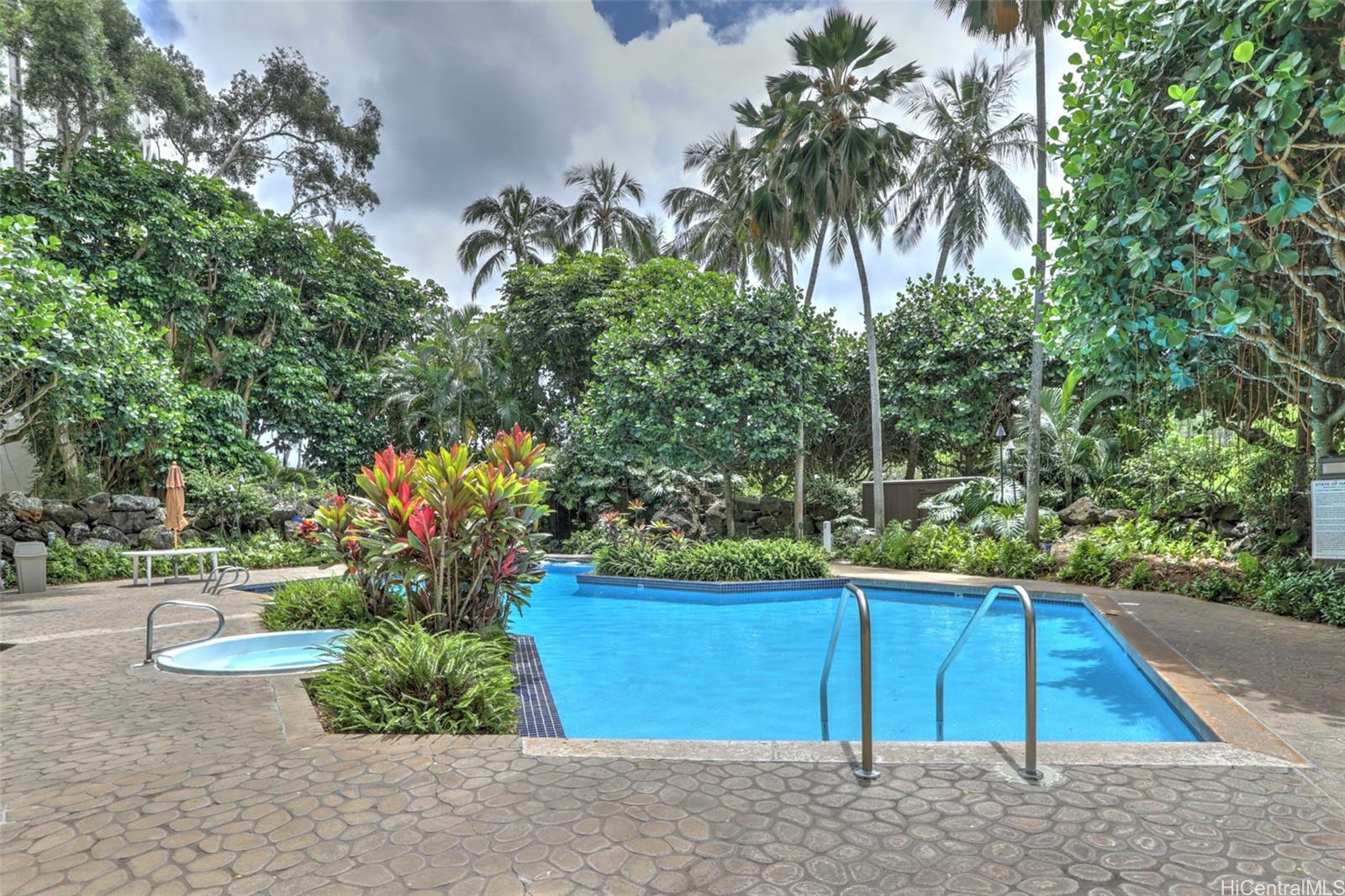 555 Hahaione Street, Unit 3E Honolulu, HI 96825 - Photo 20 of 23 Lush tropical landscape surrounds the poolarea.