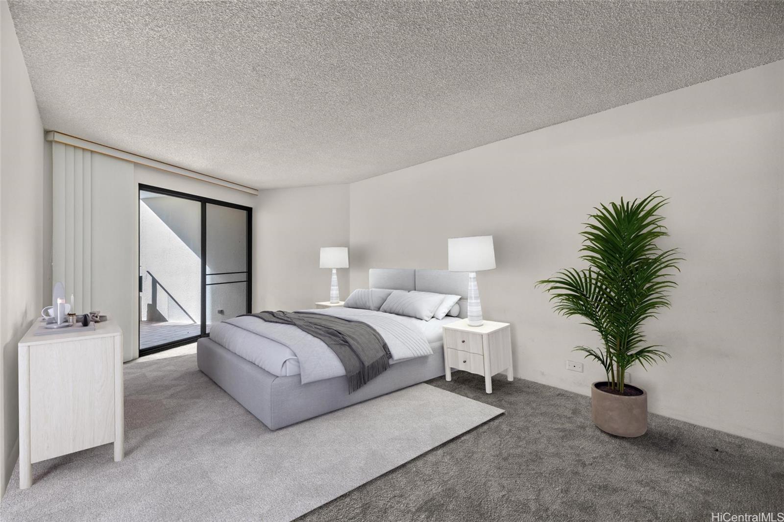 555 Hahaione Street, Unit 3E Honolulu, HI 96825 - Photo 2 of 25 a spacious bedroom with a large bed and a potted plant