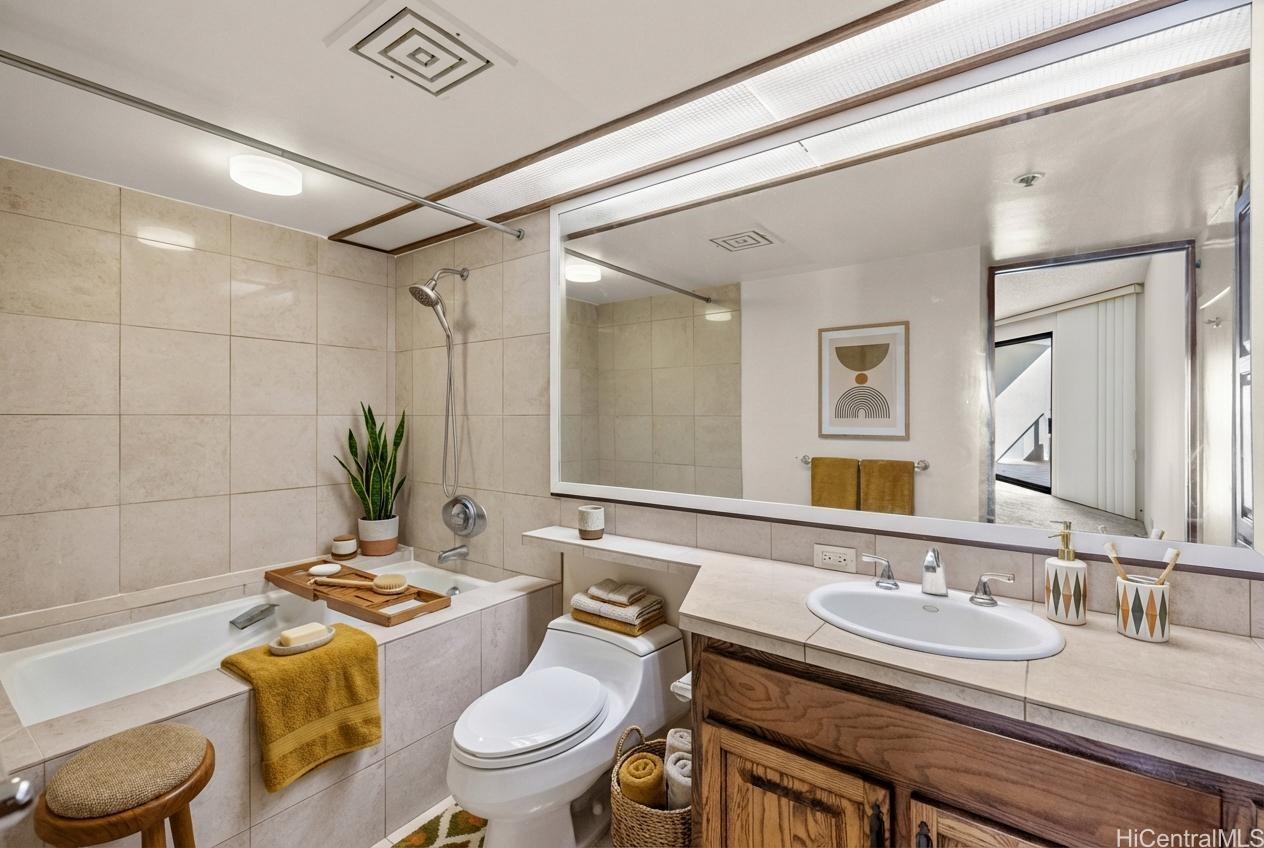 555 Hahaione Street, Unit 3E Honolulu, HI 96825 - Photo 4 of 23 Guest bathroom / laundry area*virtually staged