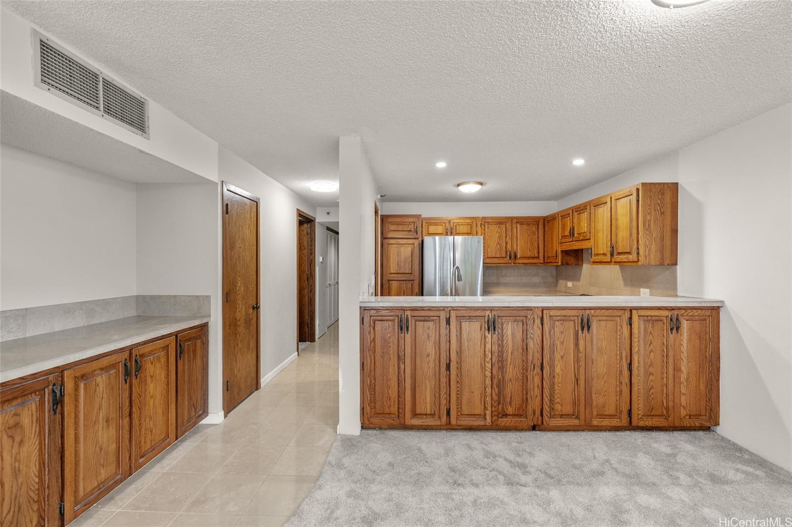555 Hahaione Street, Unit 3E Honolulu, HI 96825 - Photo 6 of 25 a view of a hallway with kitchen