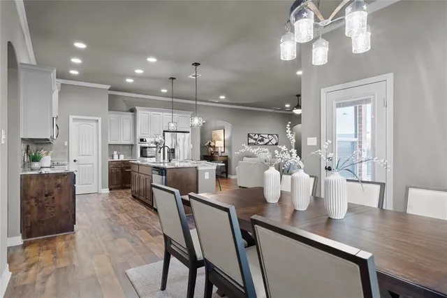 an empty room with a ceiling fan and a window