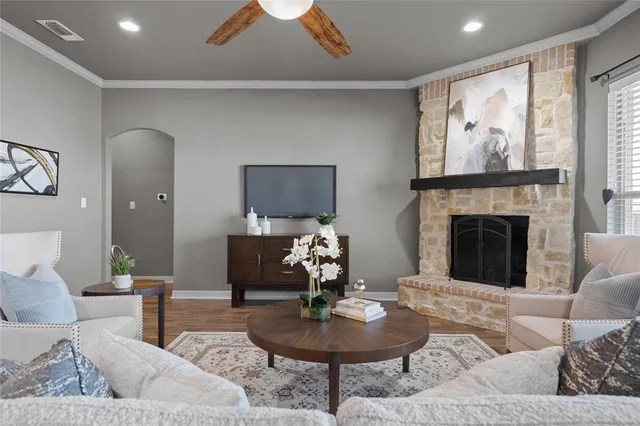 a kitchen with granite countertop a sink stove and cabinets