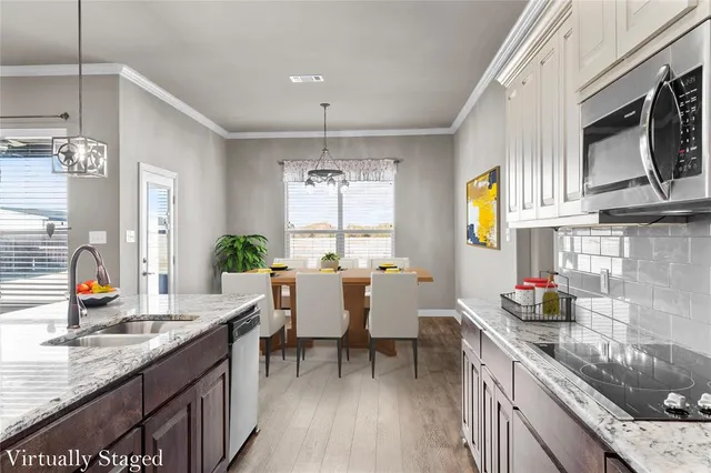 a bedroom with a bed tv and window