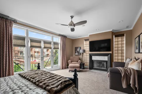 a bedroom with a bed and a fireplace