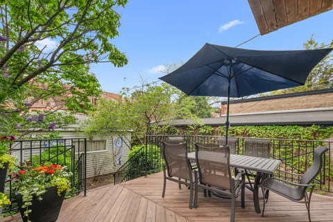 a view of an outdoor sitting area with furniture