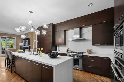 a kitchen with a sink and cabinets