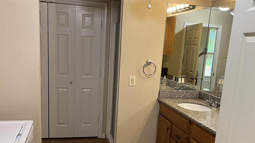 3841 Ledgestone Lane Midlothian, TX 76065 - Photo 6 of 26 a bathroom with a granite countertop sink and a mirror