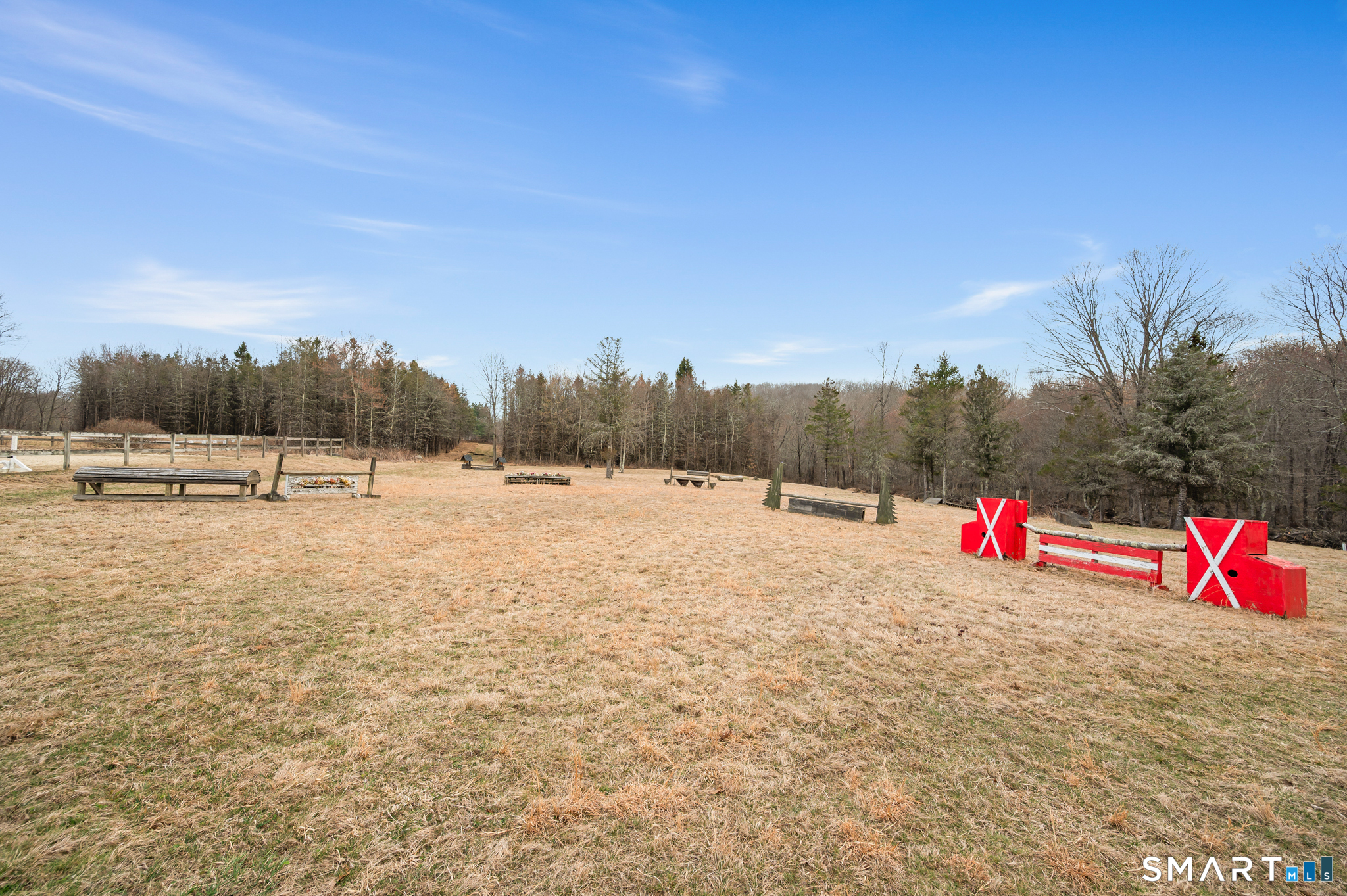 76 Cowles Road Woodbury, CT 06798 - Photo 16 of 39 Show jumping areas and trails run through the landscape.