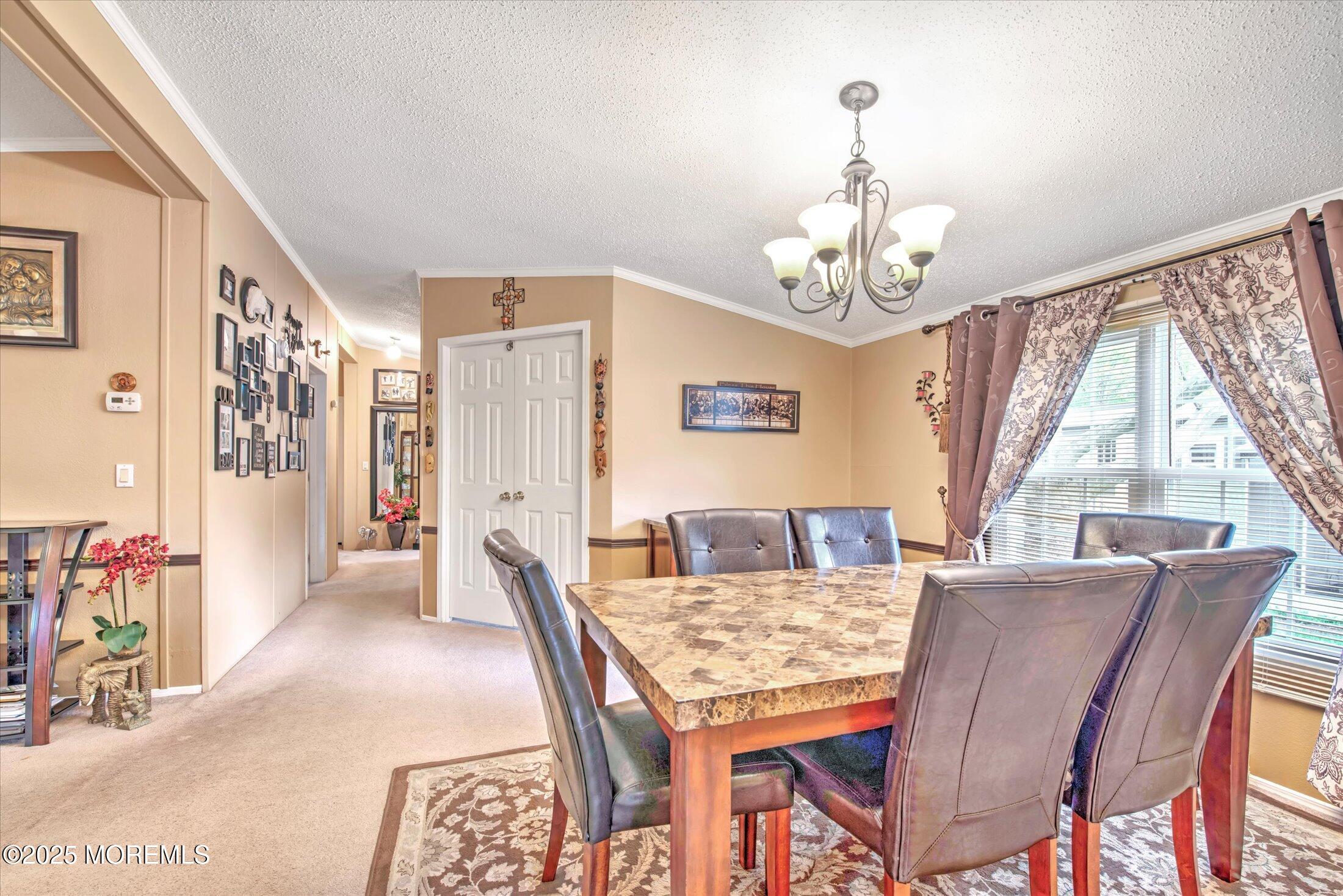 38 Village Road Morganville, NJ 07751 - Photo 11 of 20 a view of a dining room with furniture window and outside view