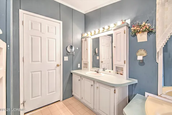 a spacious bathroom with a double vanity sink mirror and