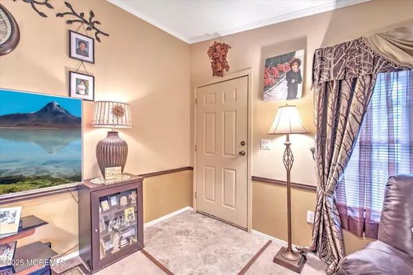 a view of a hallway with paintings on the wall