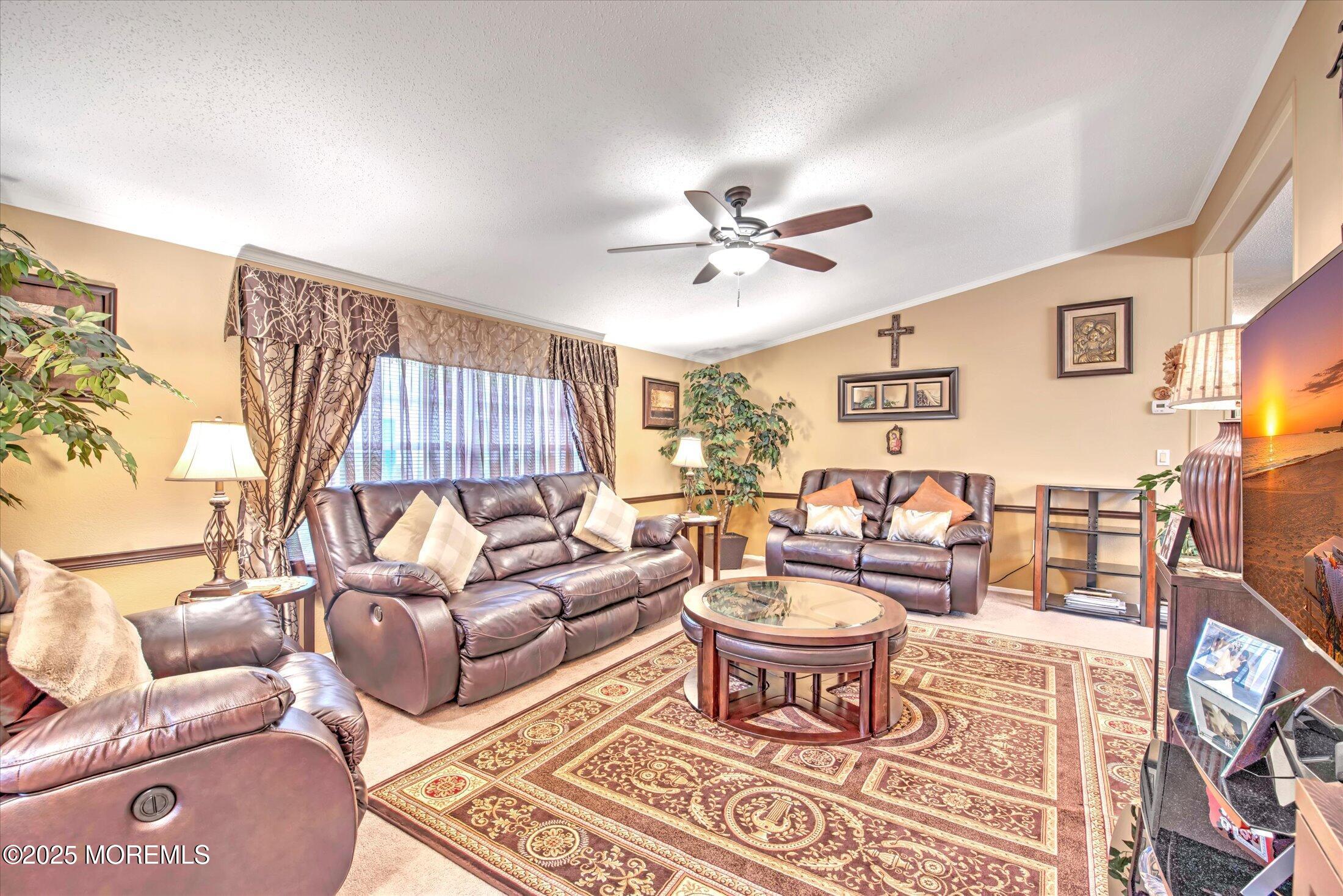38 Village Road Morganville, NJ 07751 - Photo 5 of 20 a living room with furniture a rug and a window