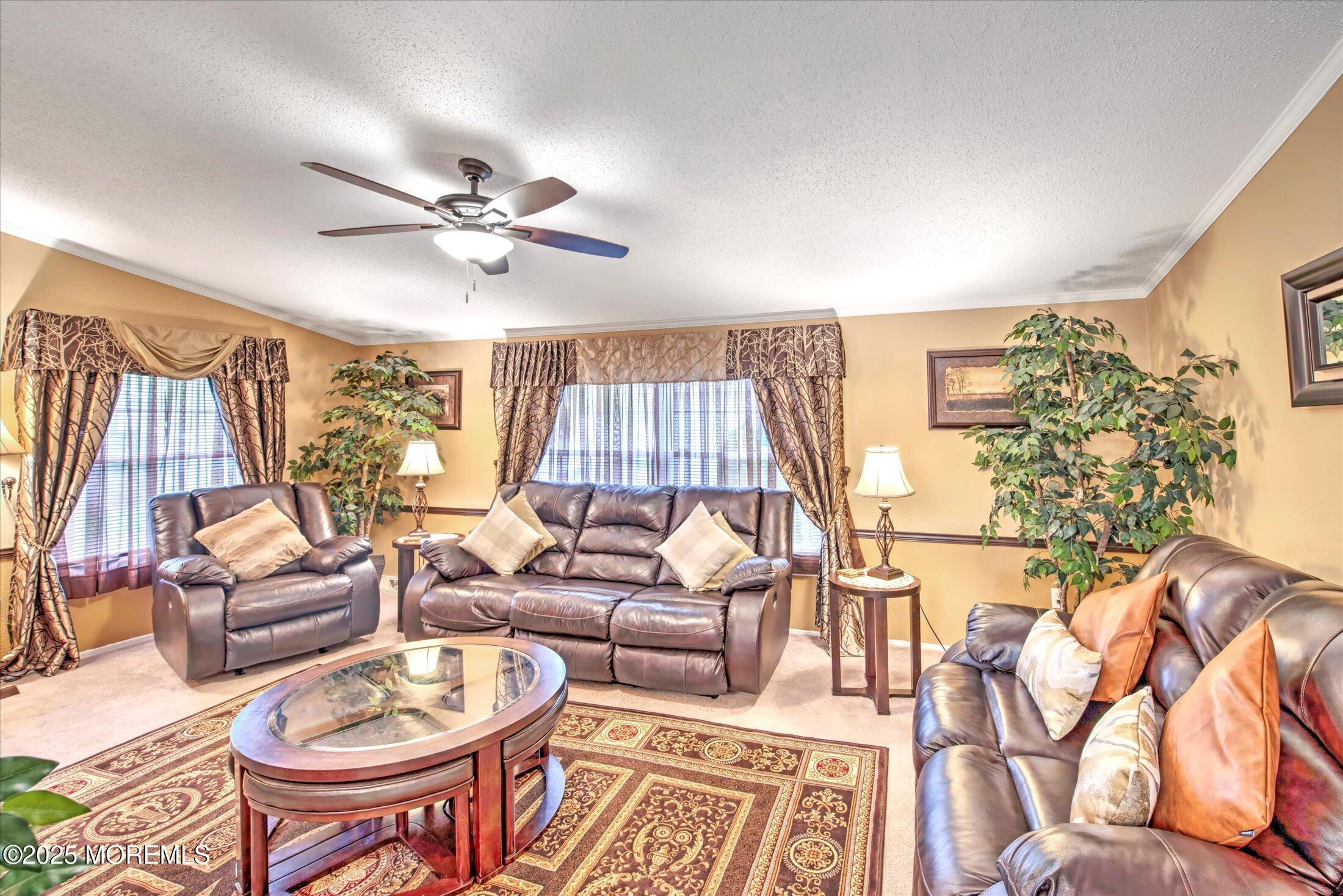 38 Village Road Morganville, NJ 07751 - Photo 7 of 20 a living room with furniture and a large window