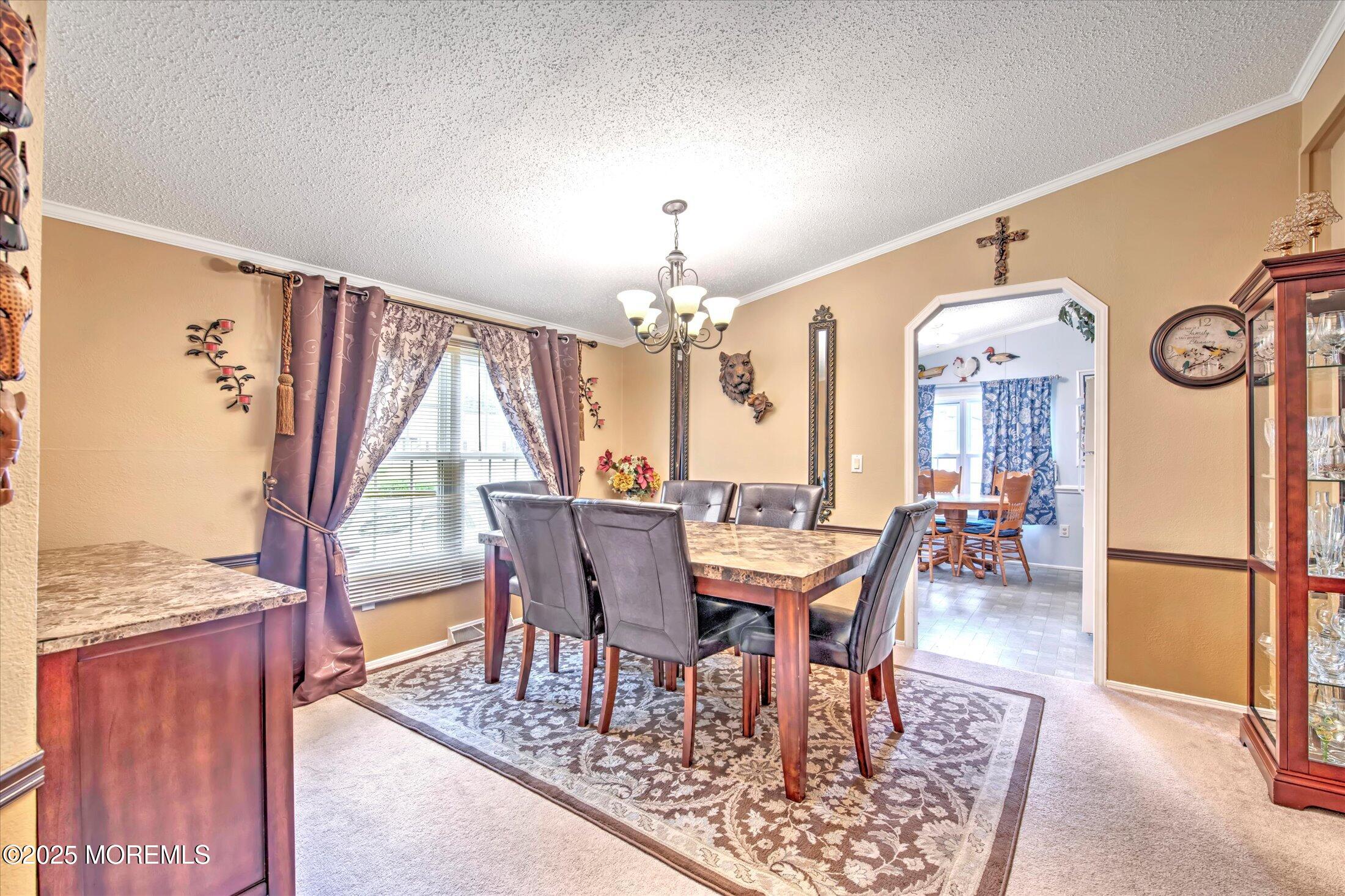 38 Village Road Morganville, NJ 07751 - Photo 9 of 20 a view of a dining room with furniture window and wooden floor