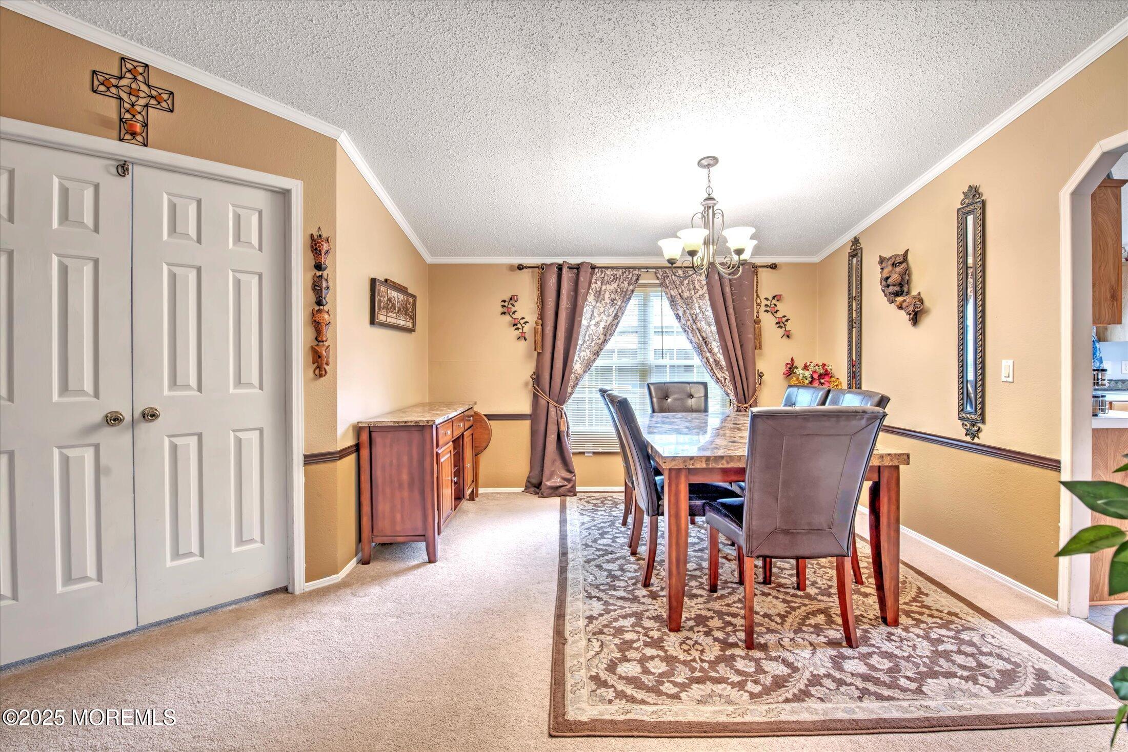 38 Village Road Morganville, NJ 07751 - Photo 10 of 20 a dining room with furniture window and wooden floor