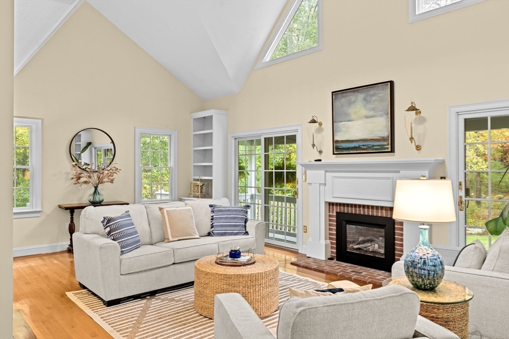 9 Forest Scituate Ma, Unit 9 Scituate, MA 02066 - Photo 12 of 35 a living room with furniture a window and a fireplace