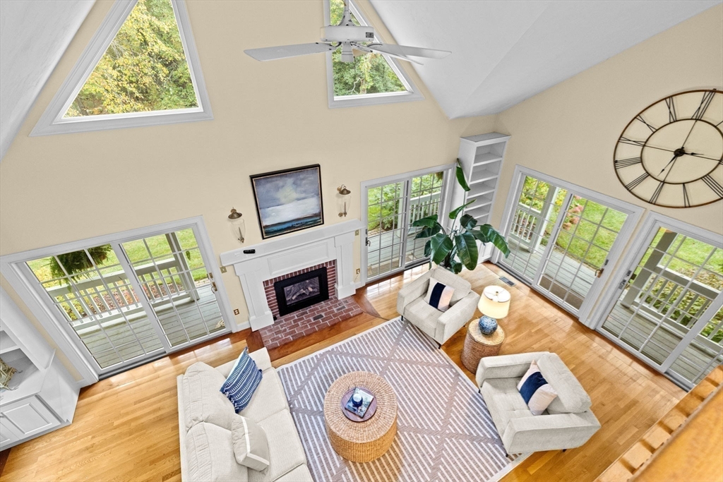 9 Forest Scituate Ma, Unit 9 Scituate, MA 02066 - Photo 13 of 35 a living room with furniture and a fireplace