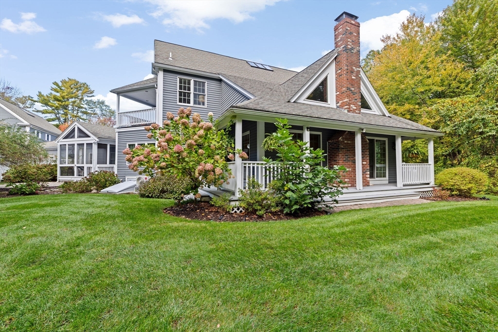 9 Forest Scituate Ma, Unit 9 Scituate, MA 02066 - Photo 2 of 35 a front view of a house with a yard
