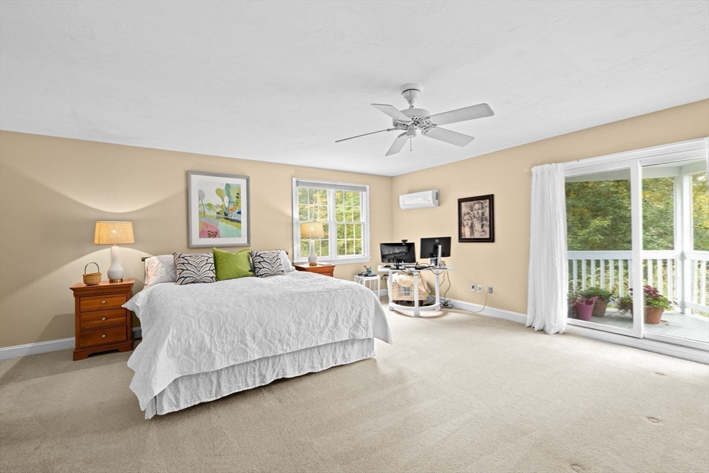 9 Forest Scituate Ma, Unit 9 Scituate, MA 02066 - Photo 22 of 35 a spacious bedroom with a bed and large window