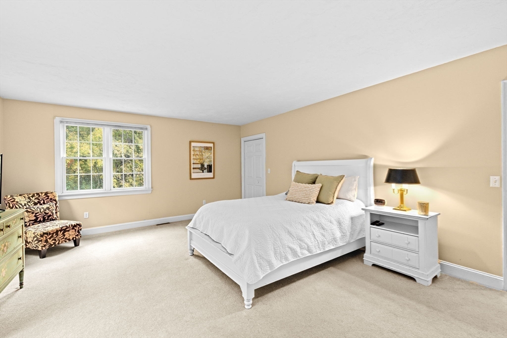 9 Forest Scituate Ma, Unit 9 Scituate, MA 02066 - Photo 26 of 35 a bedroom with a bed and window