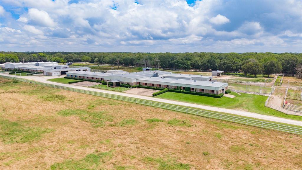4509 Diamond D Road Lone Oak, TX 75453 - Photo 13 of 36 a view of yard with swimming pool and trees in the background