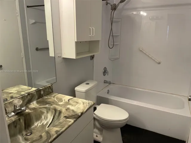 a kitchen with cabinets and appliances