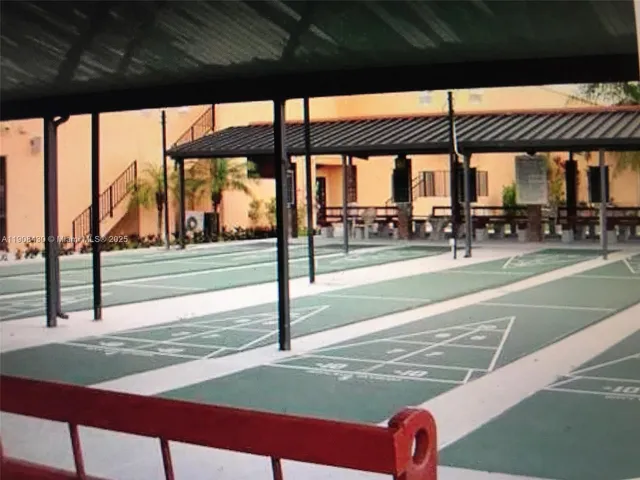 a reading room with furniture and book shelf