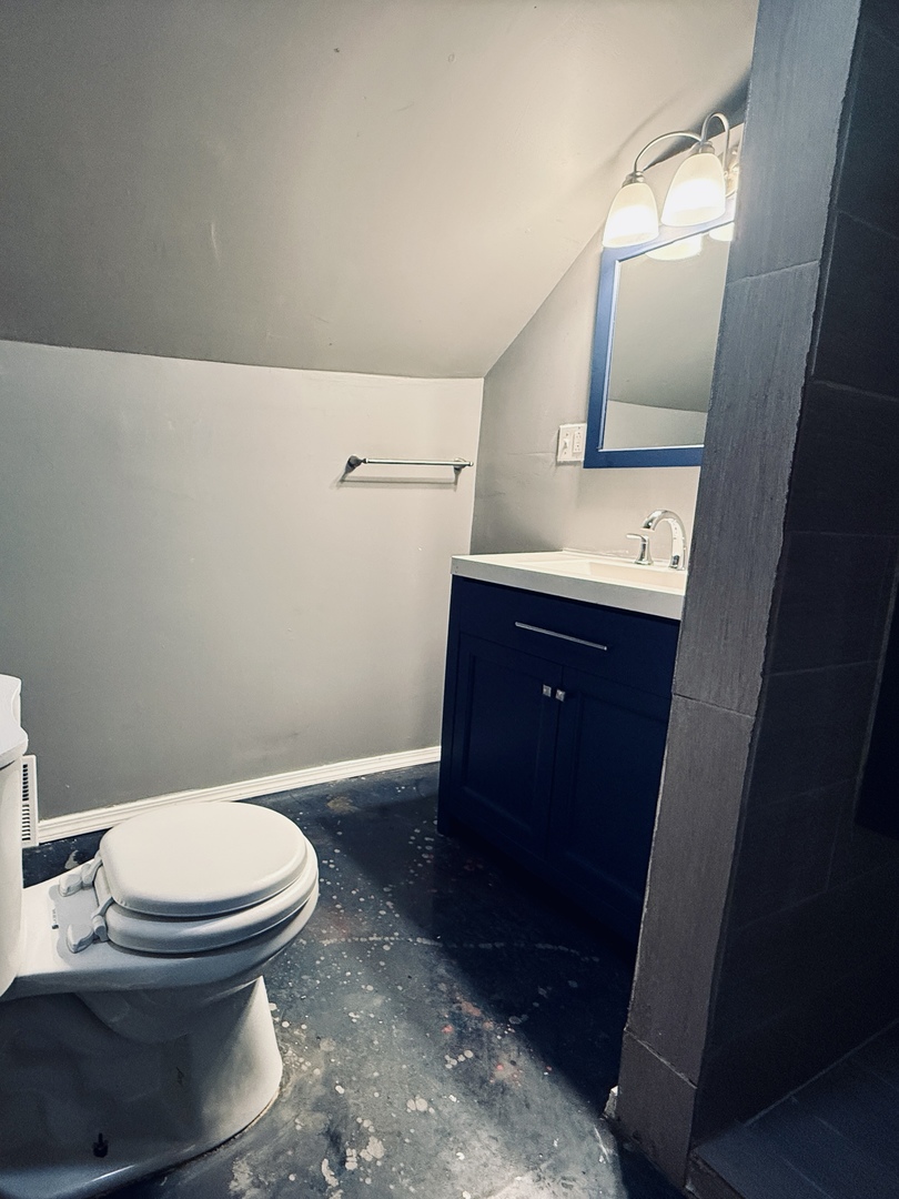 11725 South Morgan Street Chicago, IL 60643 - Photo 18 of 40 a bathroom with a sink and a toilet
