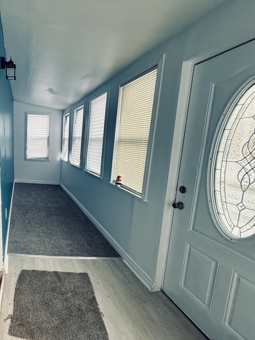 11725 South Morgan Street Chicago, IL 60643 - Photo 2 of 40 an entryway with wooden floor and windows