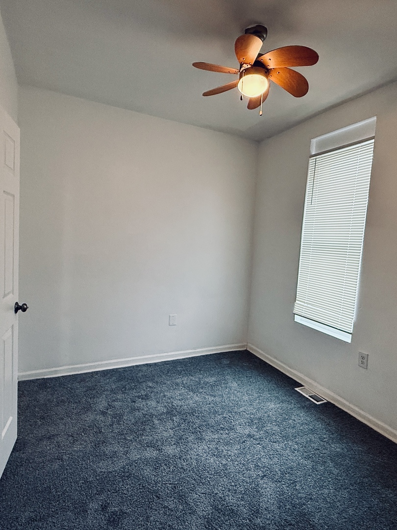 11725 South Morgan Street Chicago, IL 60643 - Photo 27 of 40 an empty room with windows and fan