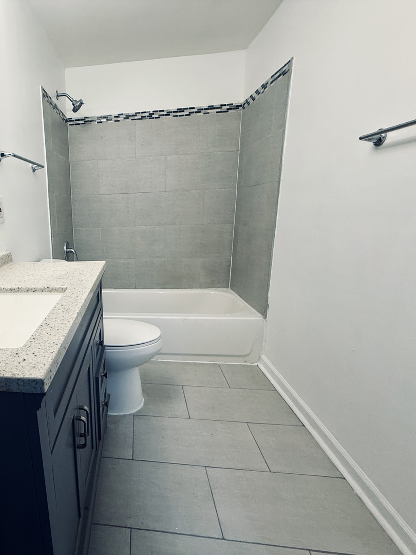 11725 South Morgan Street Chicago, IL 60643 - Photo 31 of 40 a bathroom with a granite countertop sink toilet and shower