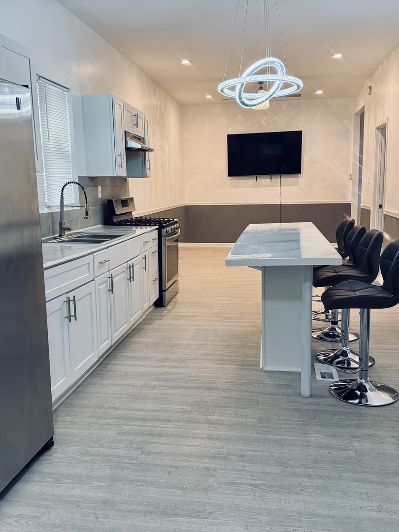 11725 South Morgan Street Chicago, IL 60643 - Photo 5 of 40 a kitchen with a sink cabinets and wooden floor