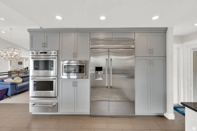 1506 Lakeview Drive Bountiful, UT 84010 - Photo 57 of 58 Kitchen with built in appliances, a warming drawer, a chandelier, gray cabinets, and open floor plan