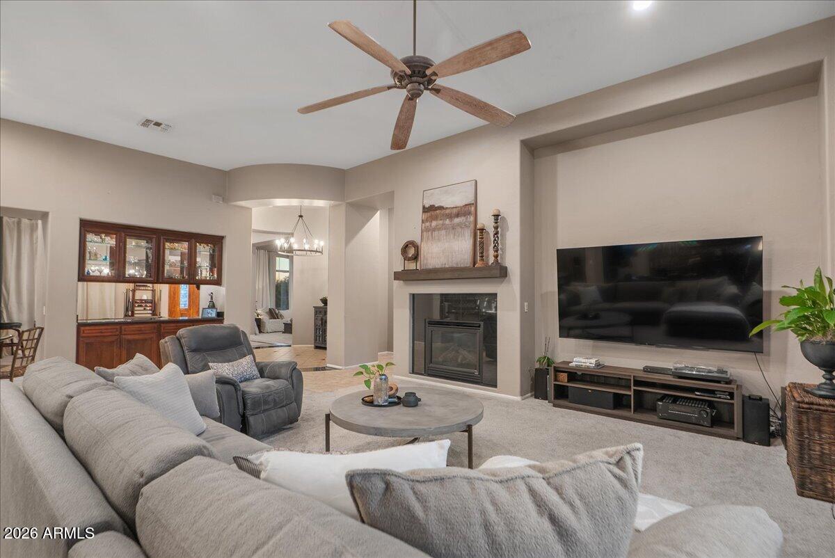 6427 South Magic Court Gilbert, AZ 85298 - Photo 22 of 71 a living room with furniture and a flat screen tv